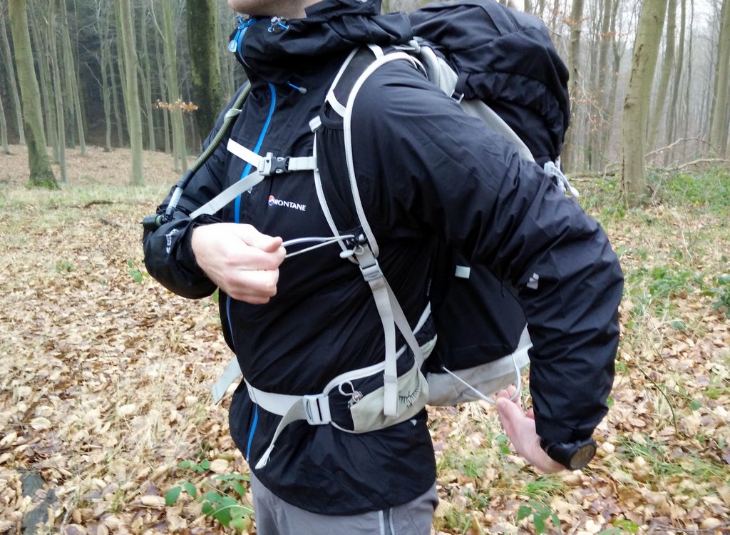 attaching trekking pole to backpack
