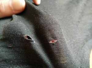 Small holes in a Merino garment
