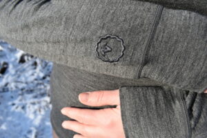 Isobaa Merino 200 Zip Neck - embroidered sheep head logo on left sleeve