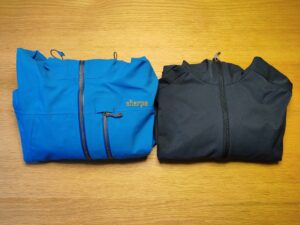 Softshell vs Hardshell Jackets: Left a Hardshell jacket and right a Softshell jacket